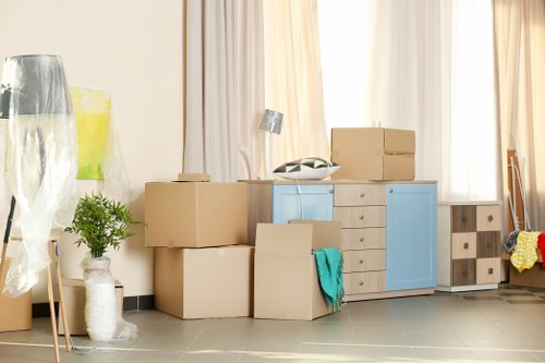 Careful packing of furniture and personal belongings for relocation