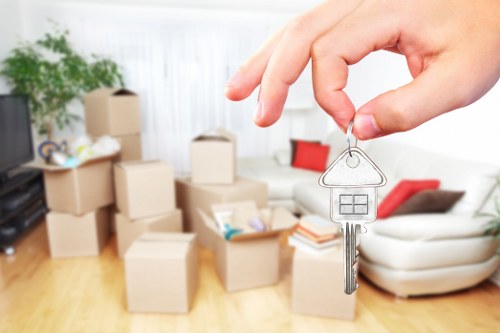 House removals in Hollandpark with moving boxes and a residential street