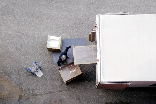 Professional packers preparing household items for a local move