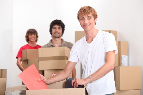 Professional moving team handling furniture during a Hollandpark relocation